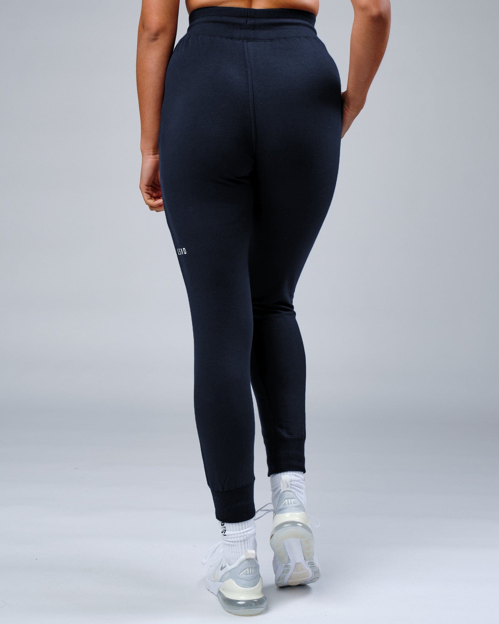 Model wearing Unisex Rival FLXFleece Track Pant - Carbon