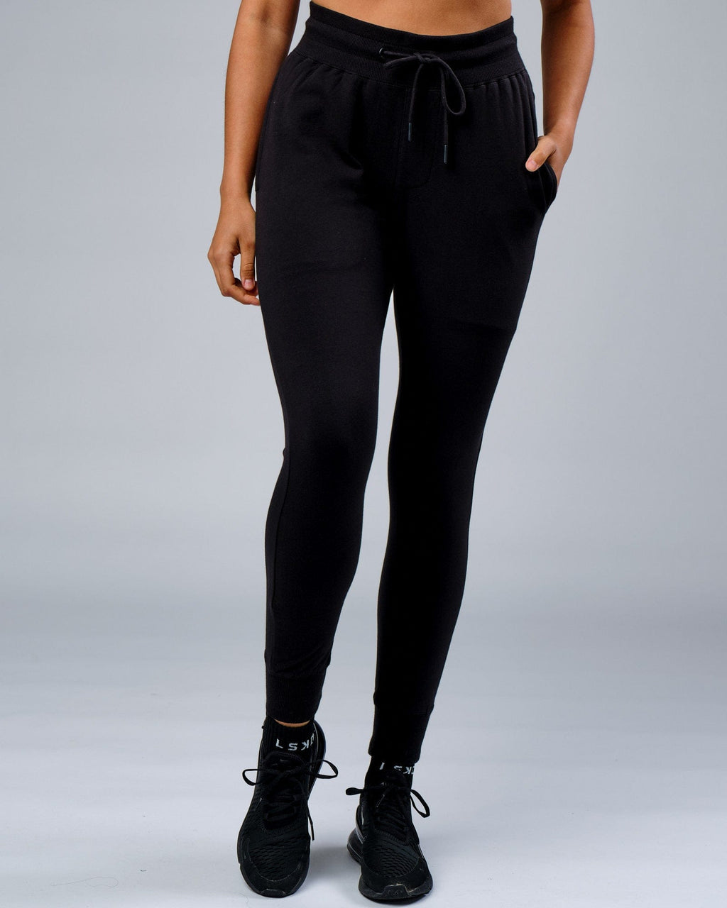 Model wearing Unisex Rival FLXFleece Track Pant - Black