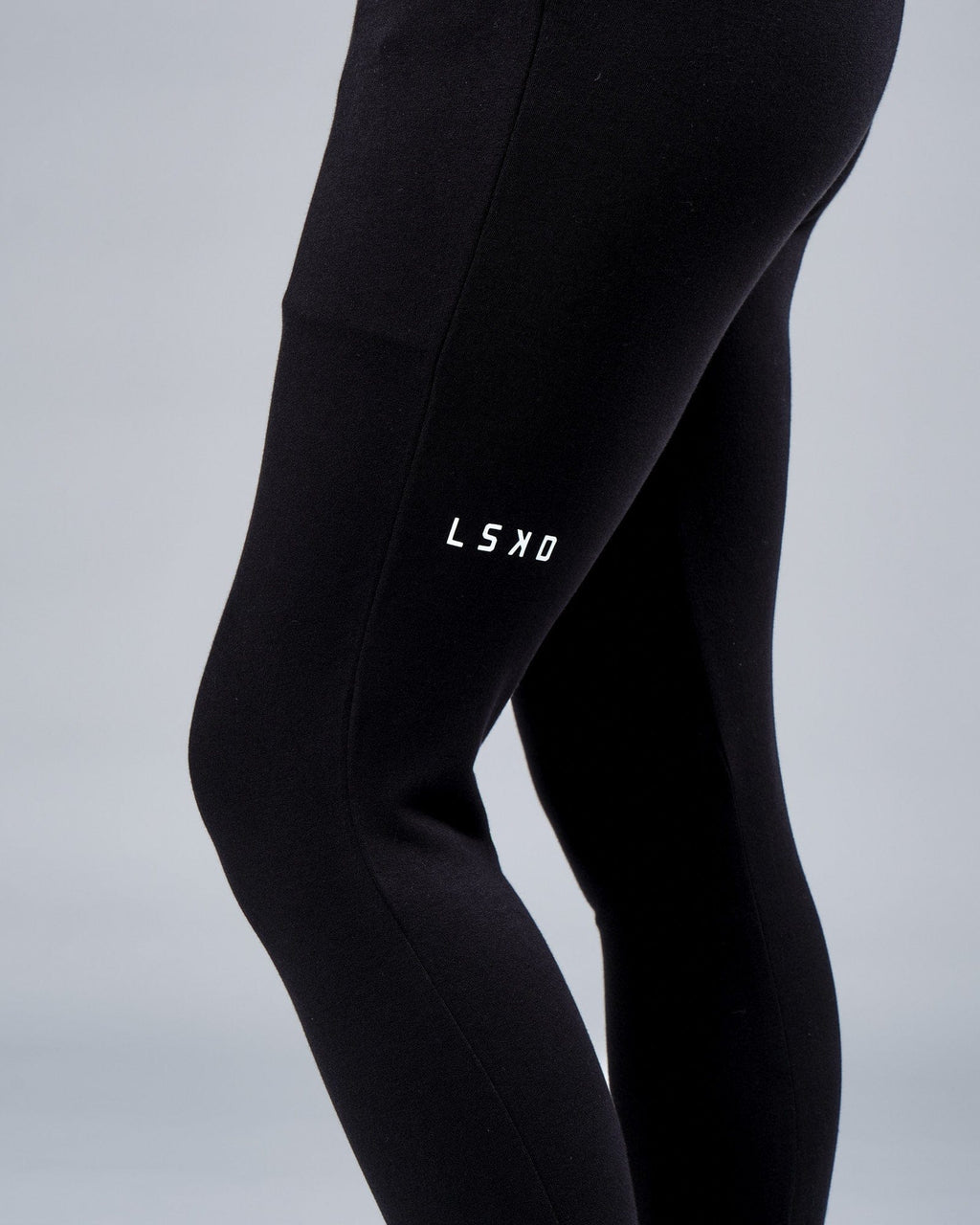 Model wearing Unisex Rival FLXFleece Track Pant - Black