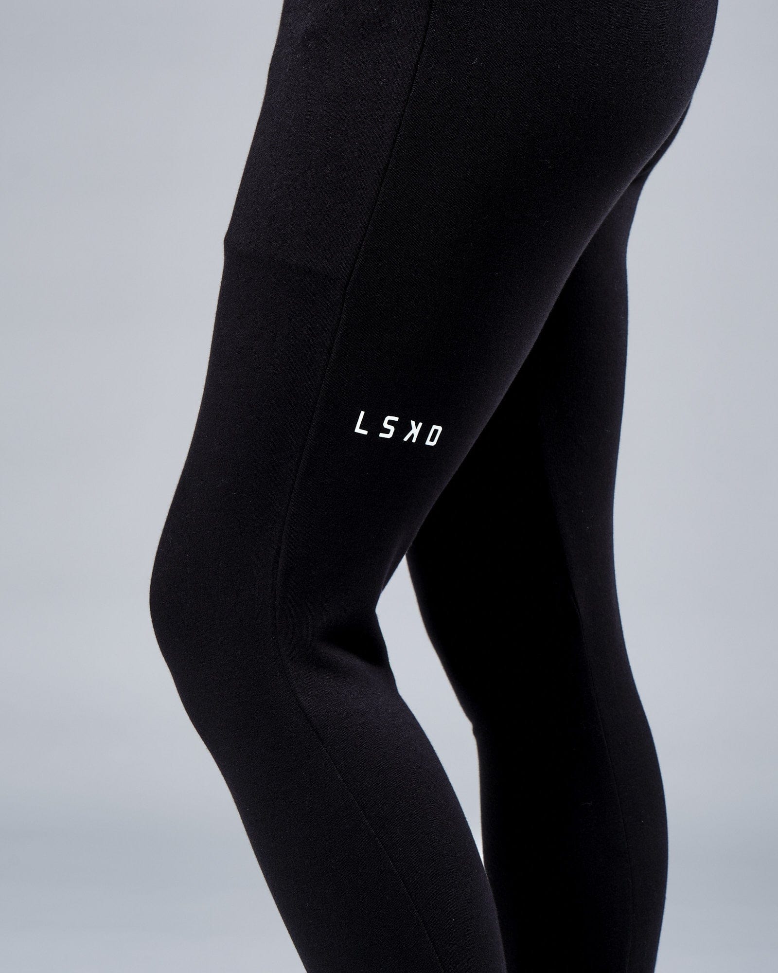 Model wearing Unisex Rival FLXFleece Track Pant - Black