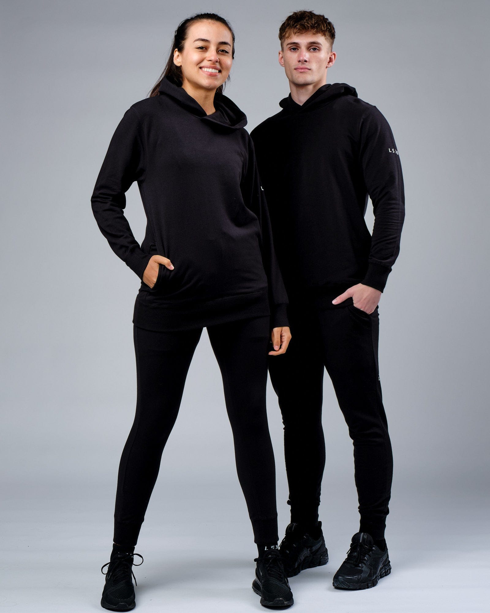 Model wearing Unisex Rival FLXFleece Training Fit Hoodie - Black