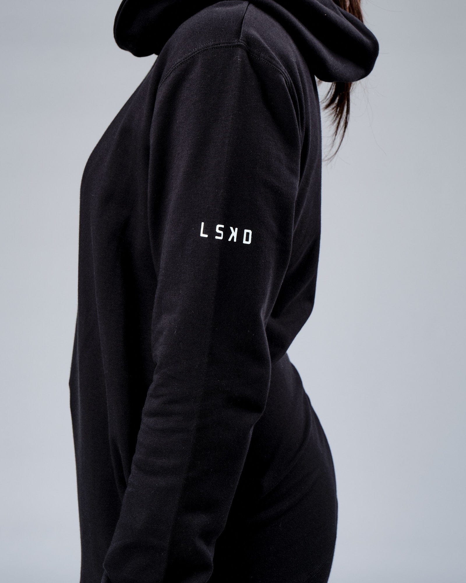 Model wearing Unisex Rival FLXFleece Training Fit Hoodie - Black