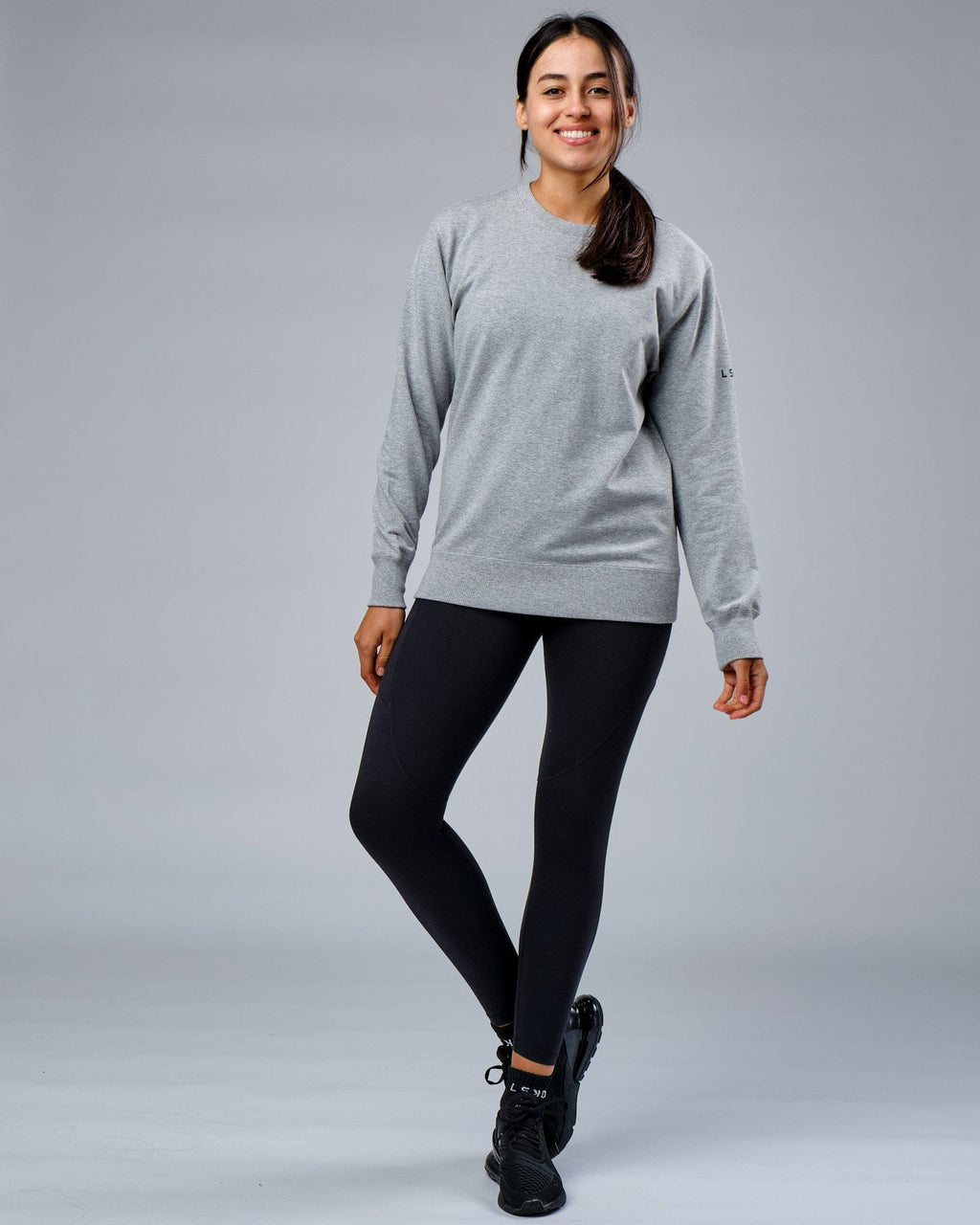 Model wearing Unisex Rival FLXFleece Training Fit Sweater - Lt Grey Marl