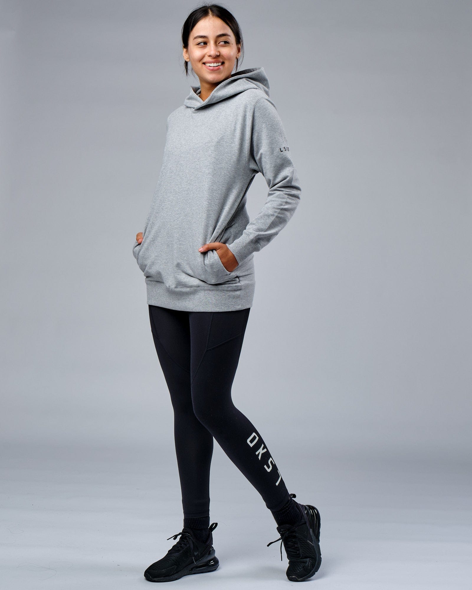 Model wearing Unisex Rival FLXFleece Training Fit Hoodie - Lt Grey Marl