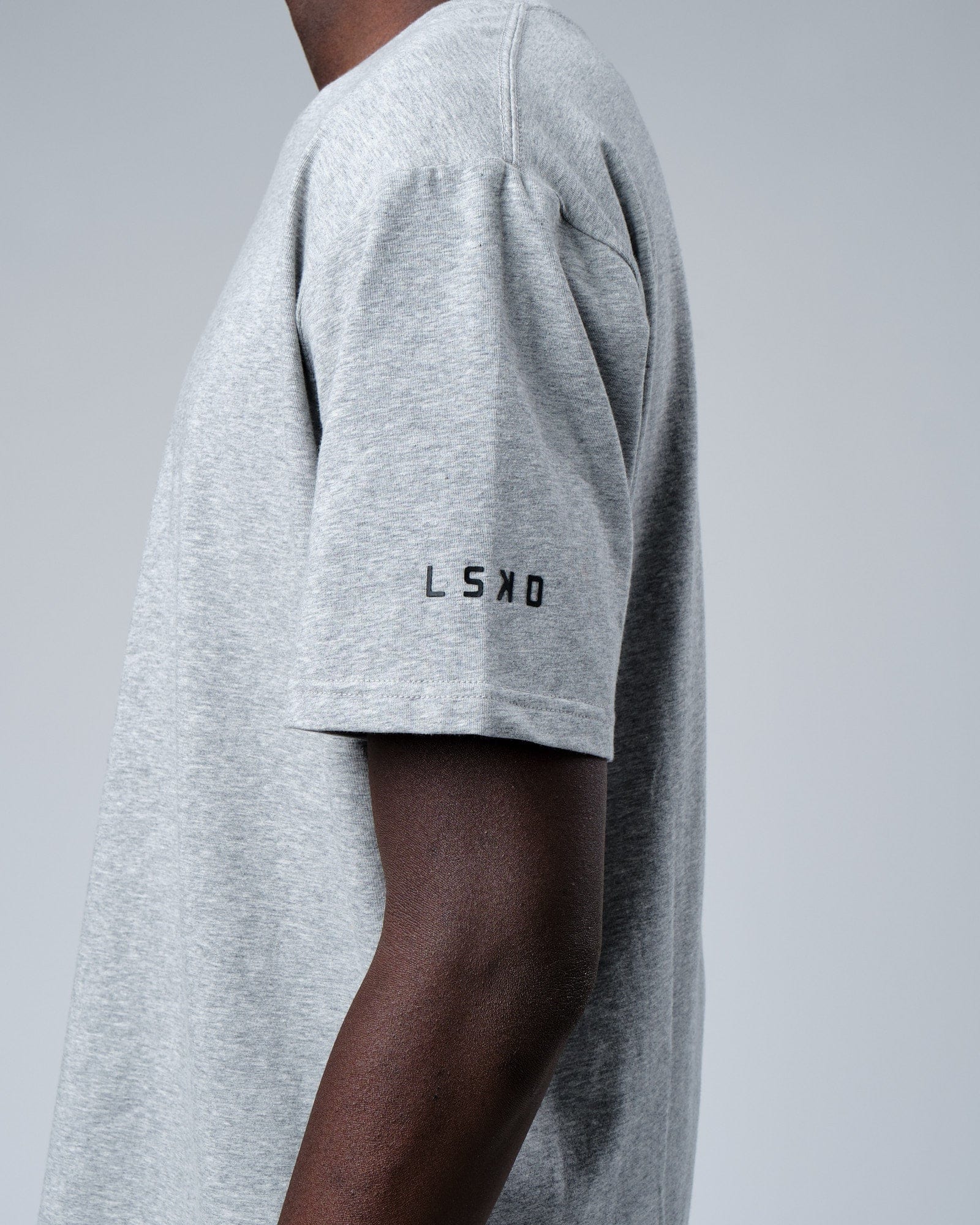 Model wearing Rival FLXCotton Training Fit Tee - Lt Grey Marl