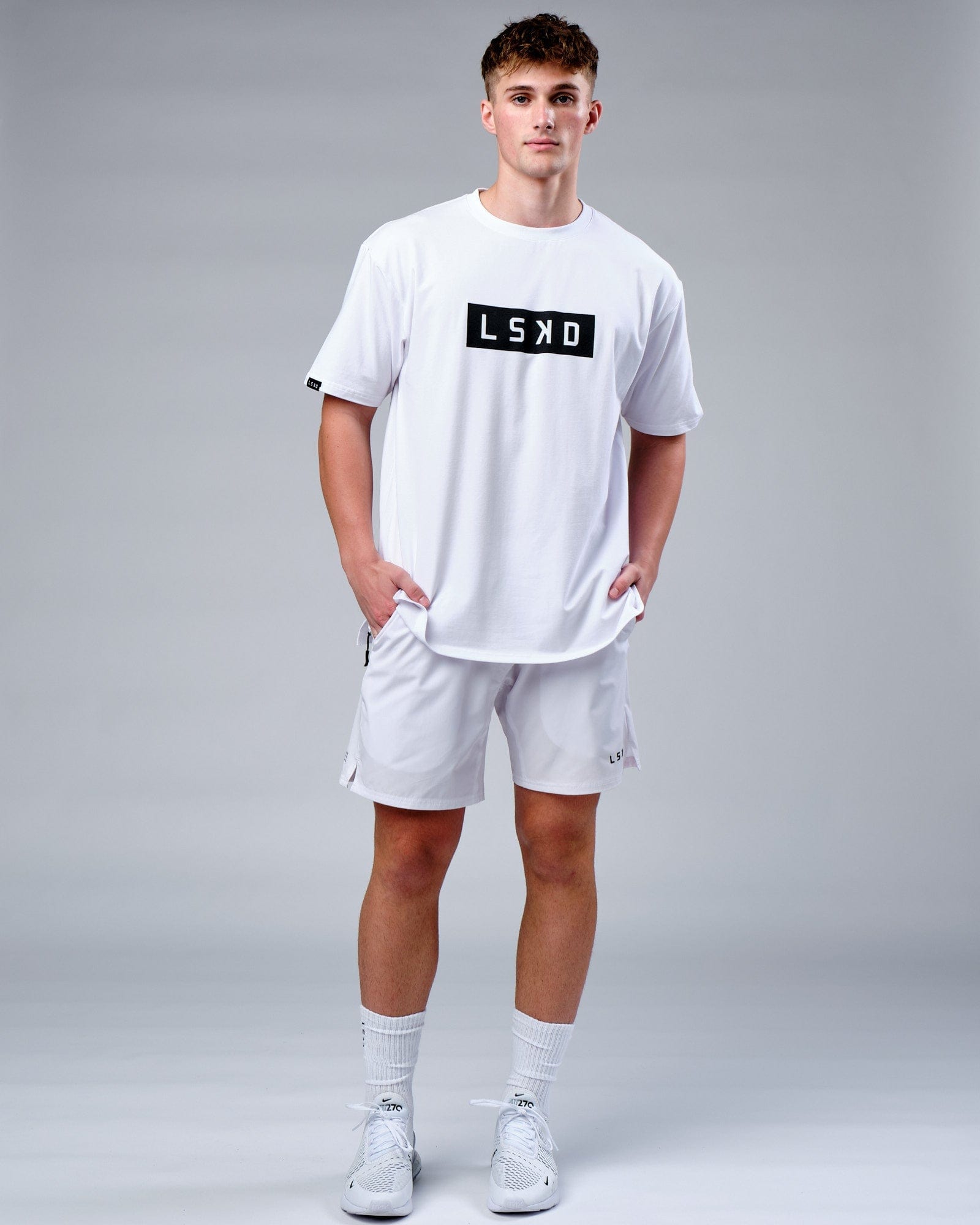 Model wearing Mood FLX Cotton Tee Oversize - White-Black
