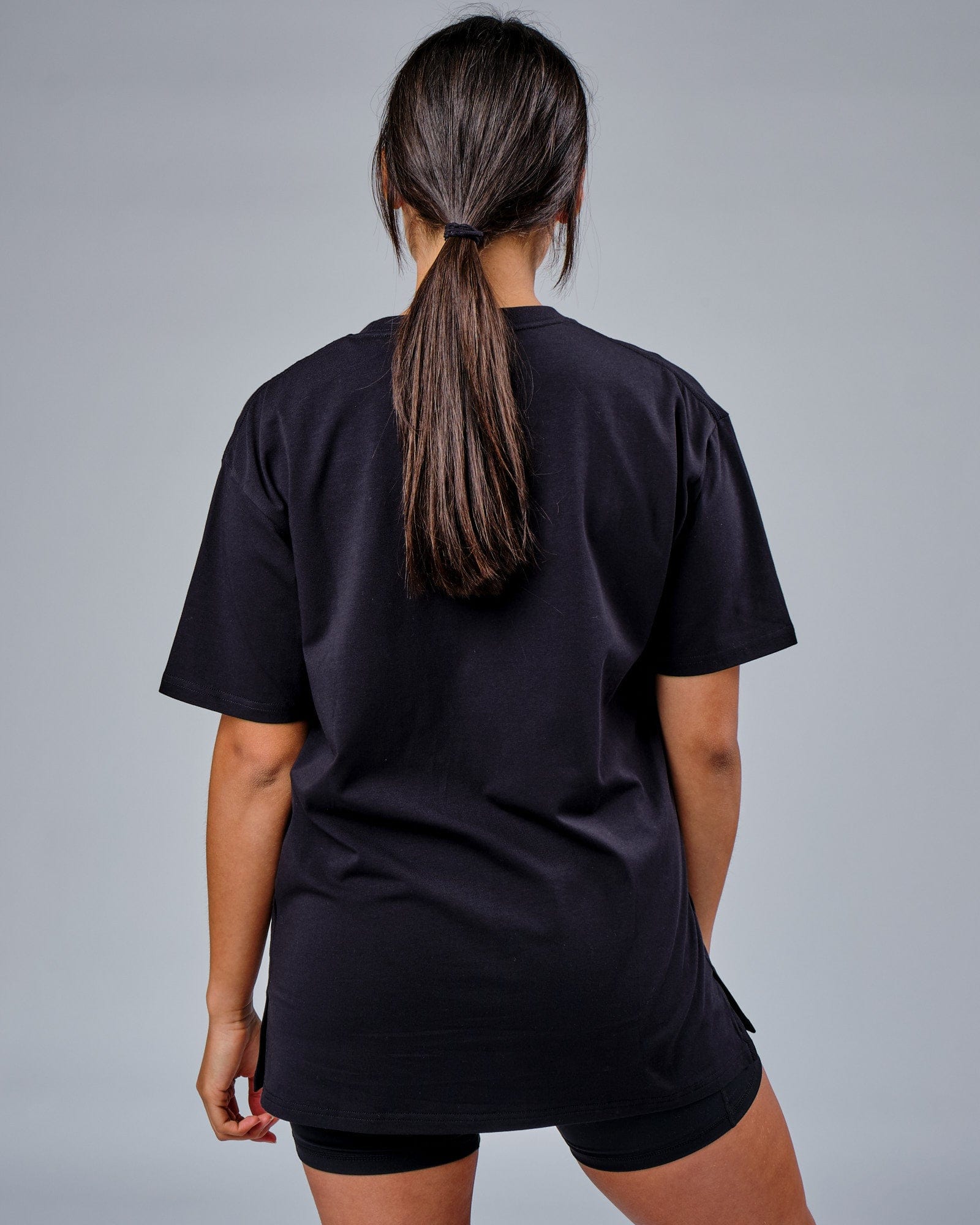 Model wearing Unisex FLXCotton Mood Tee Oversize - Black-Black