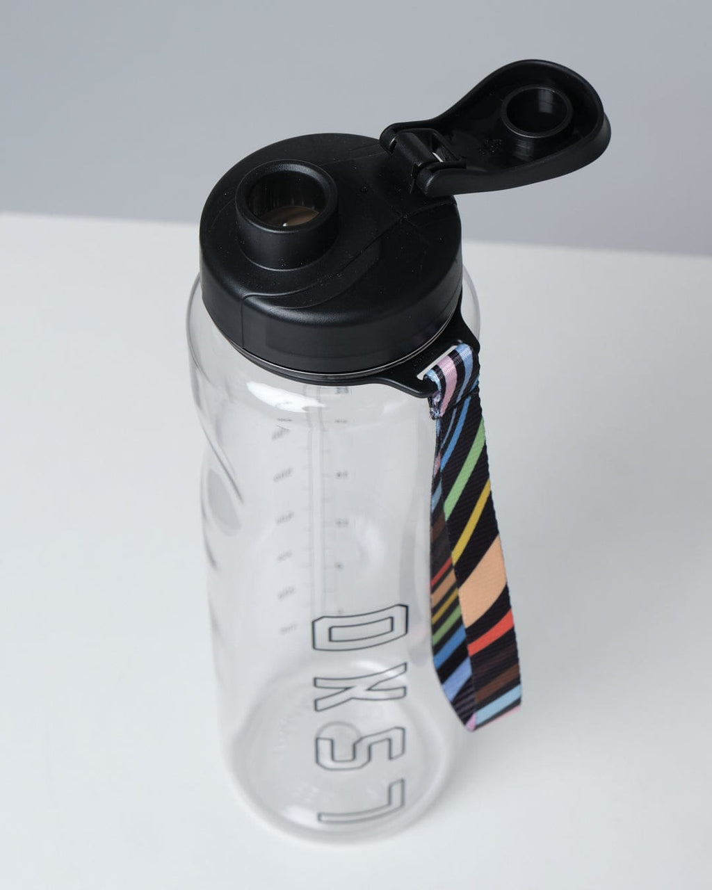 Model wearing Progress 1L Bottle - Clear-Black