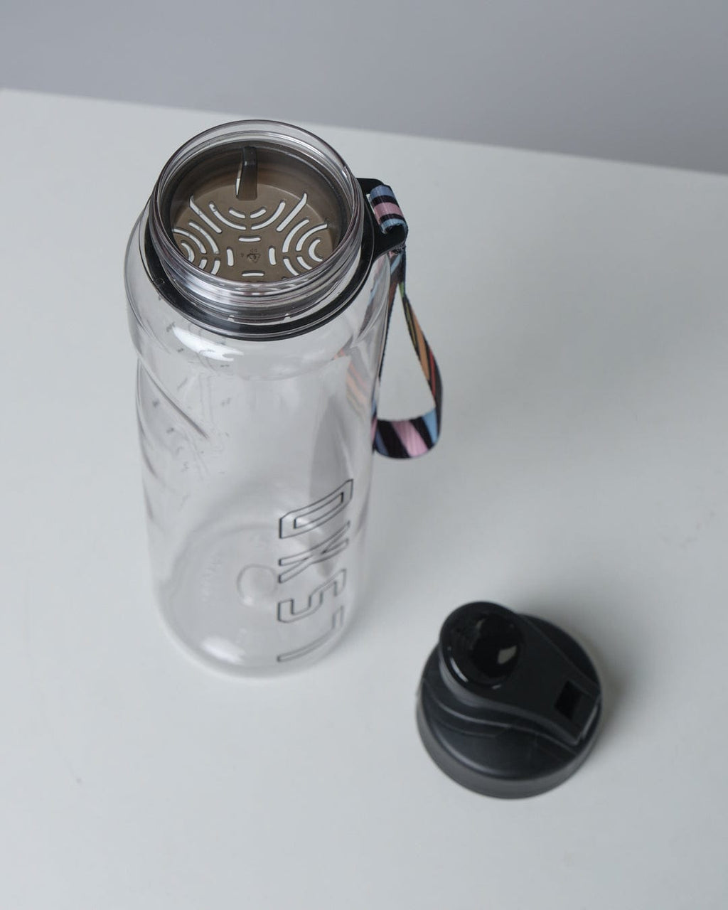 Model wearing Progress 1L Bottle - Clear-Black