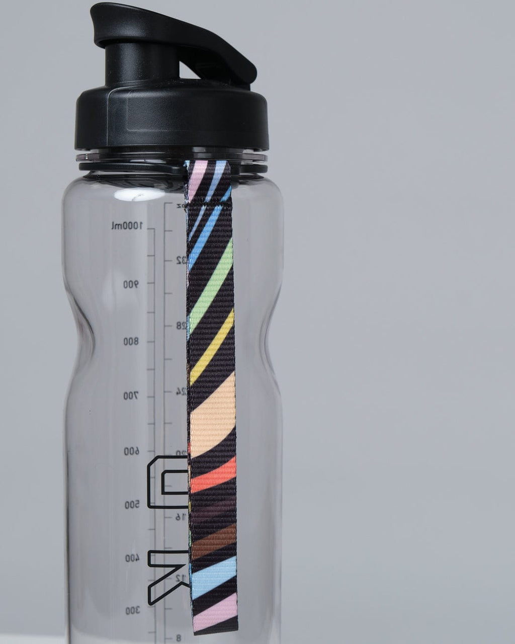 Model wearing Progress 1L Bottle - Clear-Black