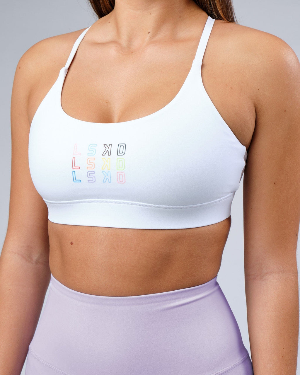 Model wearing Progress Recycled Sports Bra - White