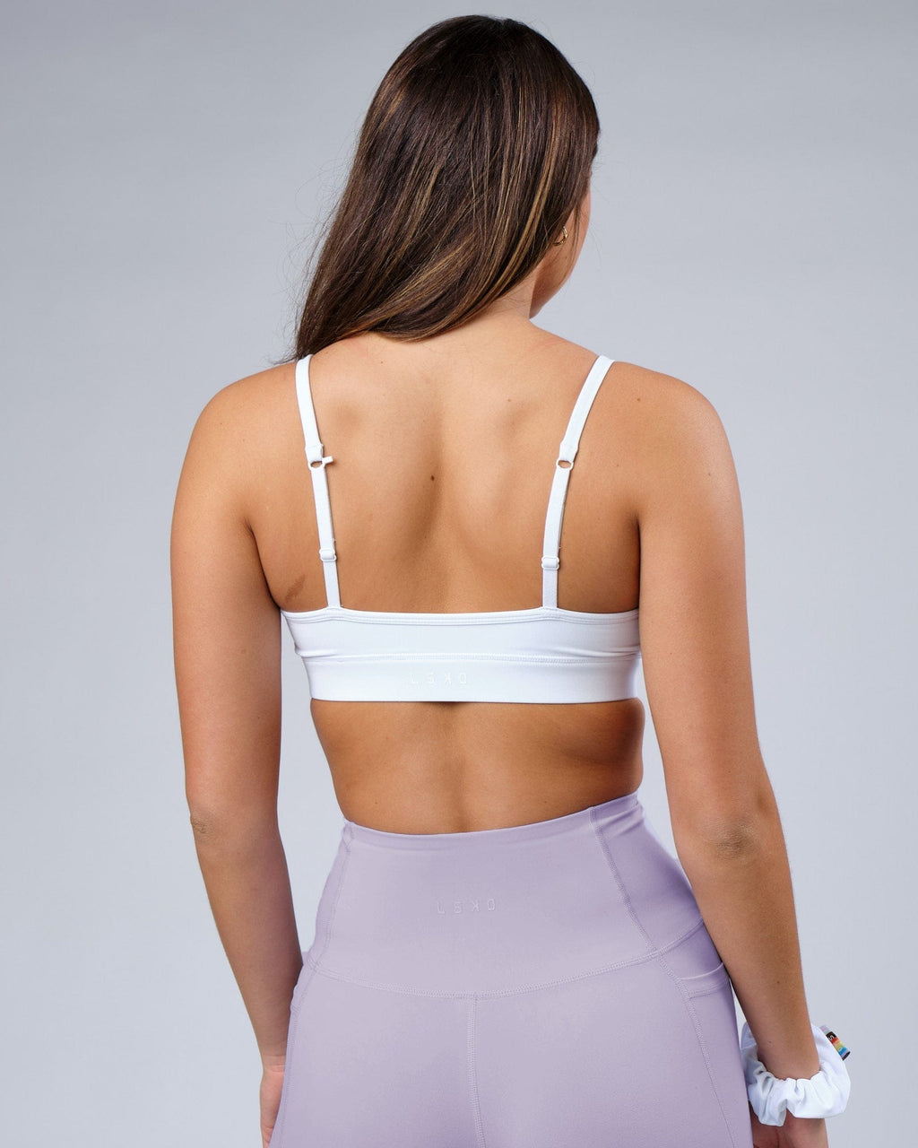 Model wearing Progress Recycled Sports Bra - White