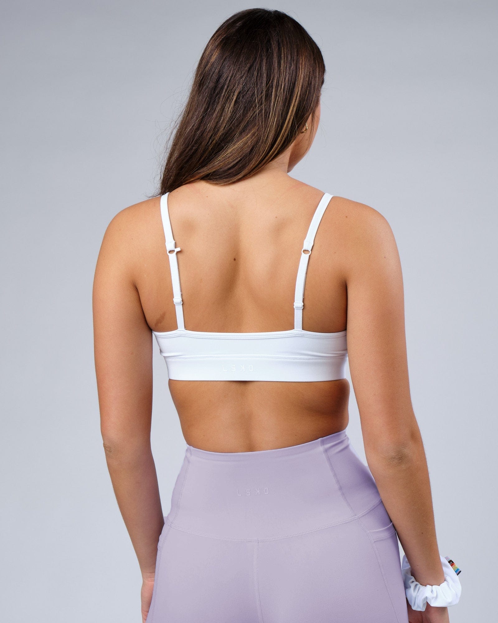 Model wearing Progress Recycled Sports Bra - White