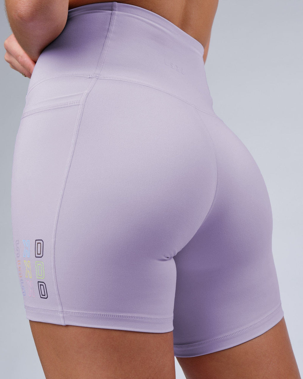 Model wearing Progress Recycled Mid Short Tight - Lavender
