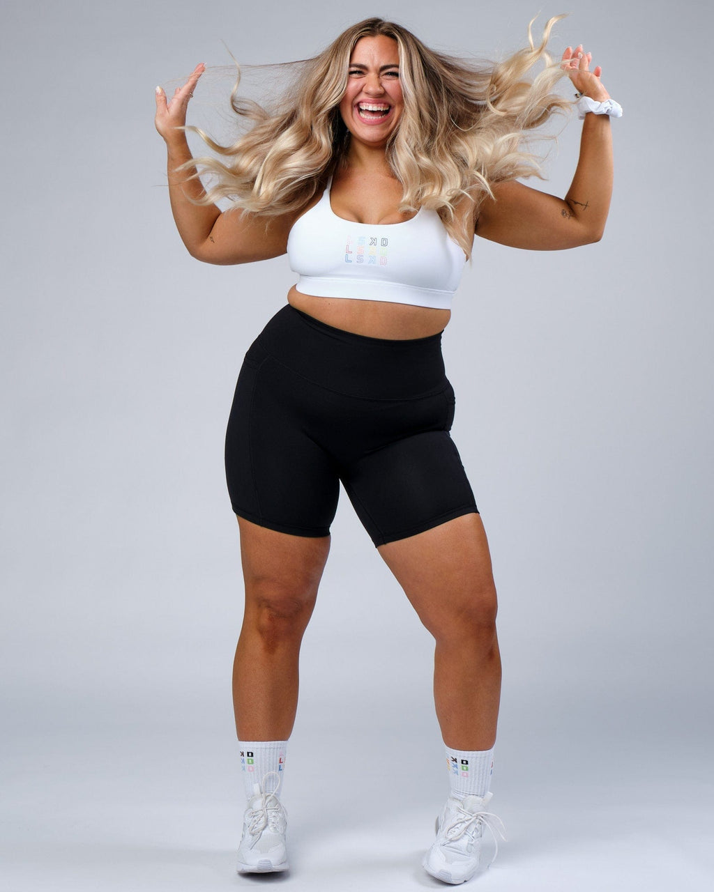 Model wearing Progress Mid Short Tight - Black