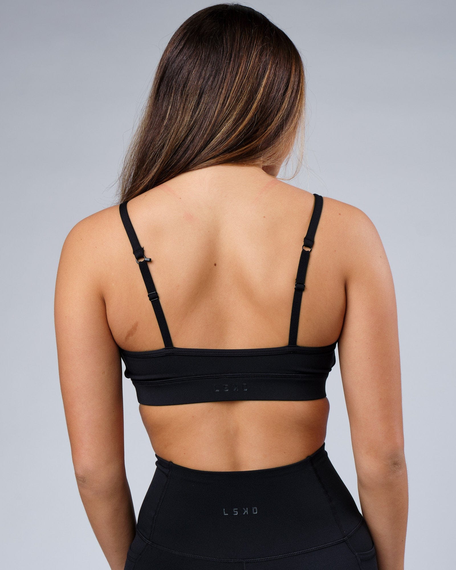 Model wearing Progress Sports Bra - Black