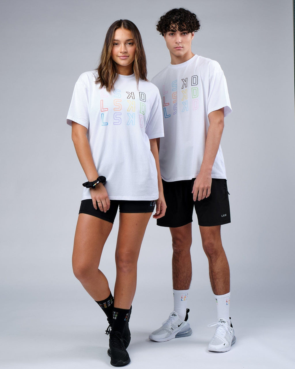 Model wearing Unisex Progress FLXCotton Tee Oversize - White