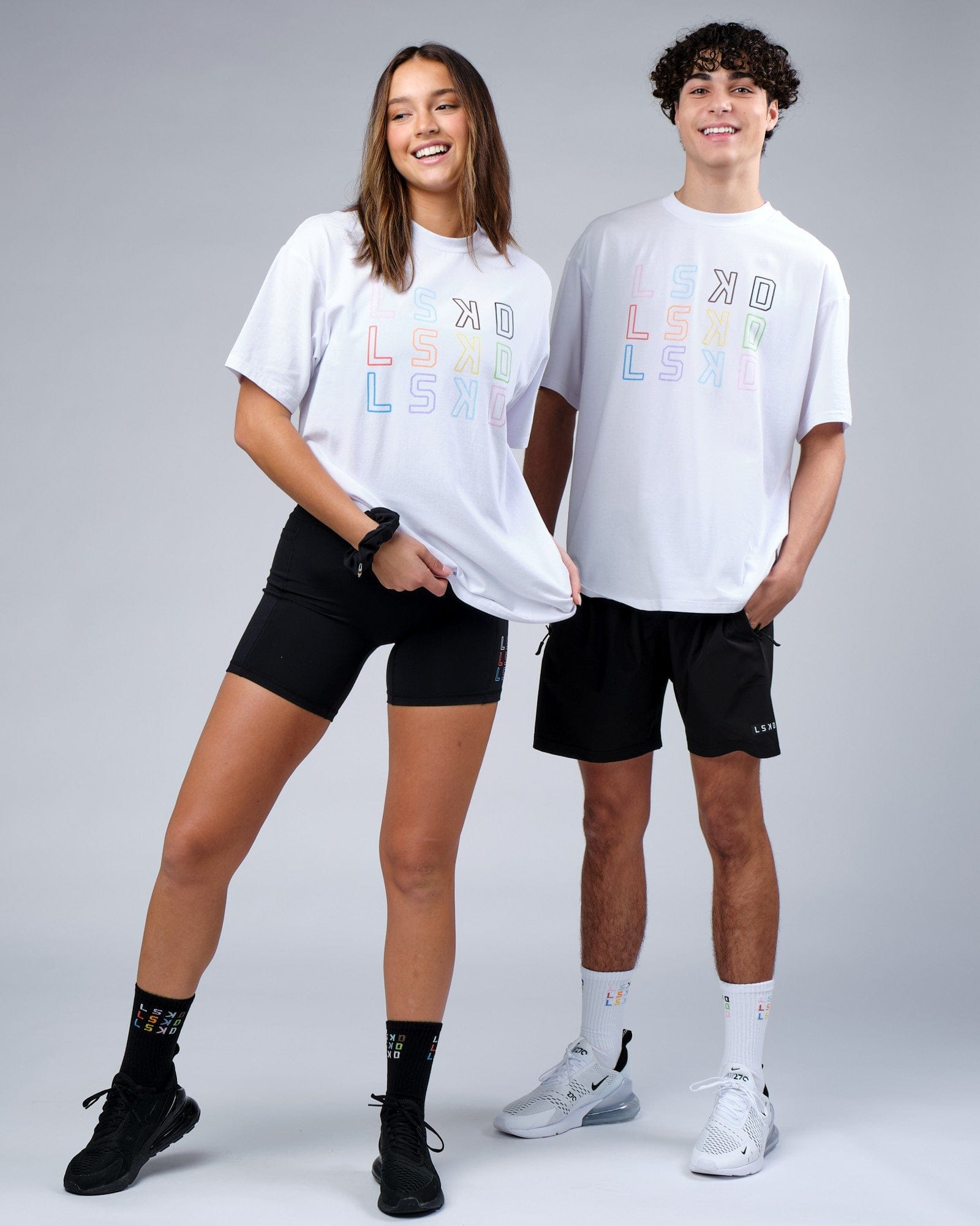 Model wearing Unisex Progress FLXCotton Tee Oversize - White