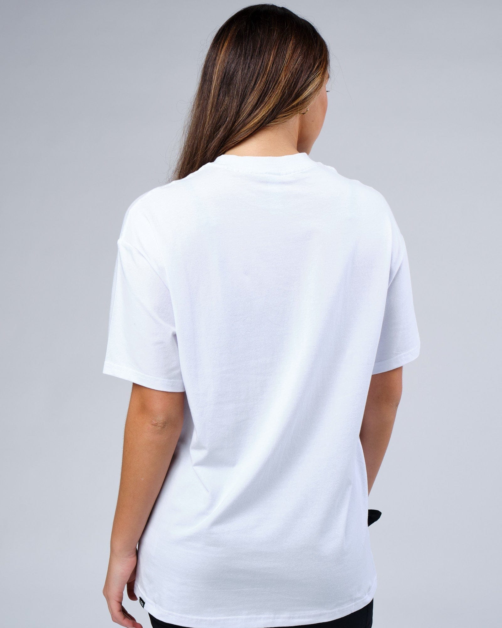 Model wearing Unisex Progress FLXCotton Tee Oversize - White