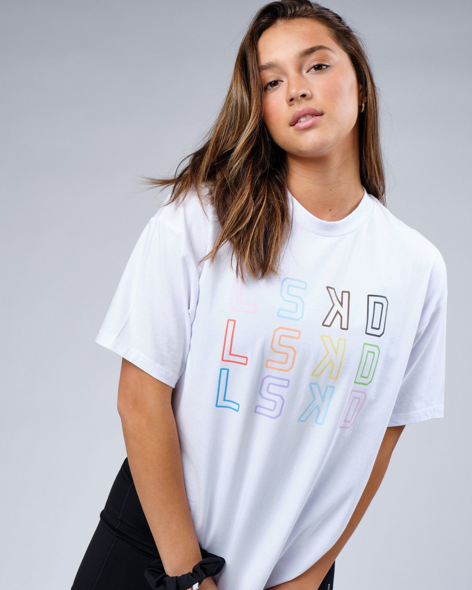 Model wearing Unisex Progress FLXCotton Tee Oversize - White