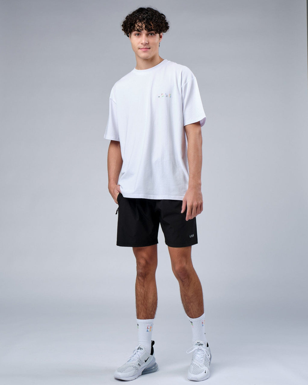 Model wearing Unity FLXCotton Tee Oversize - White