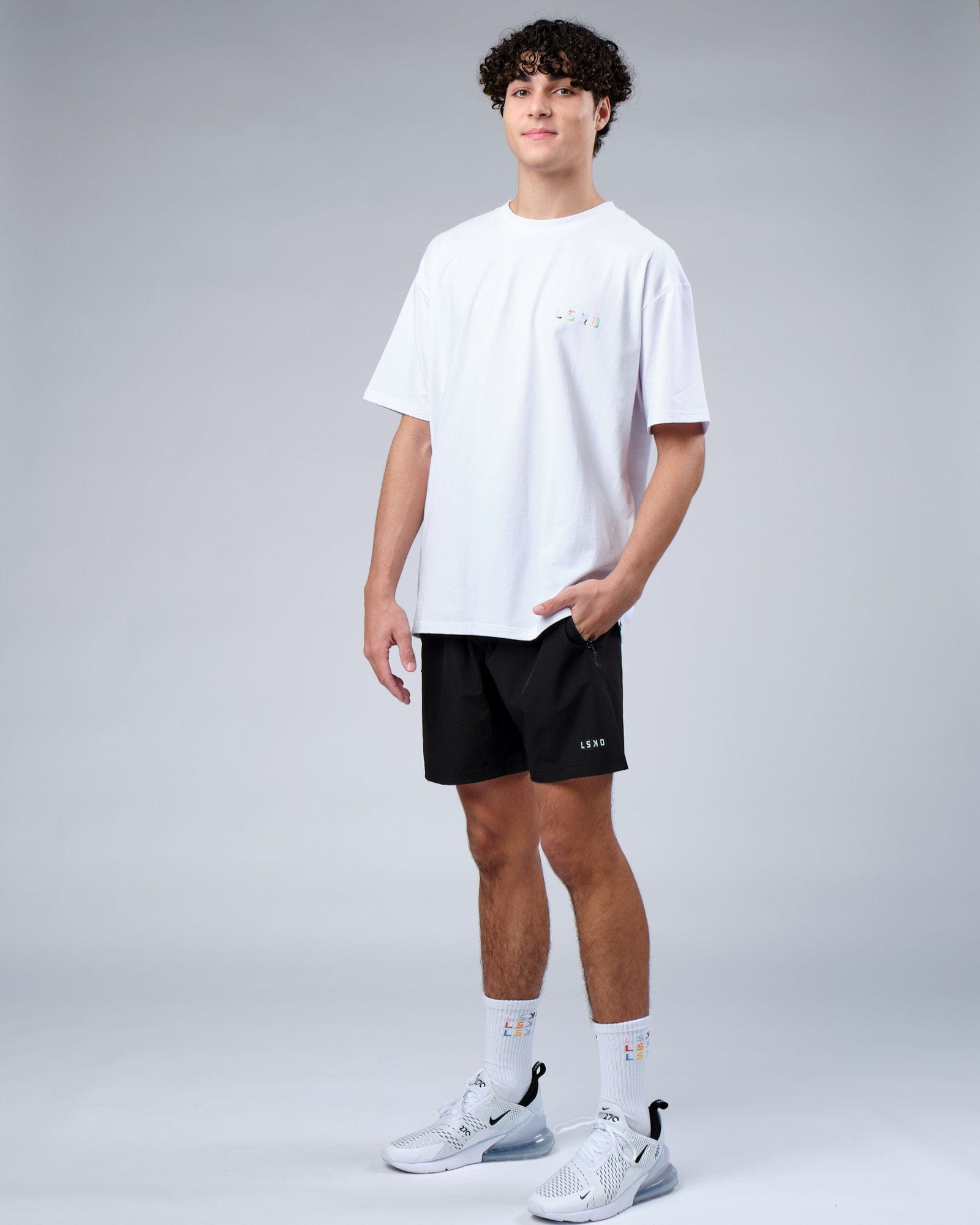 Model wearing Unity FLXCotton Tee Oversize - White