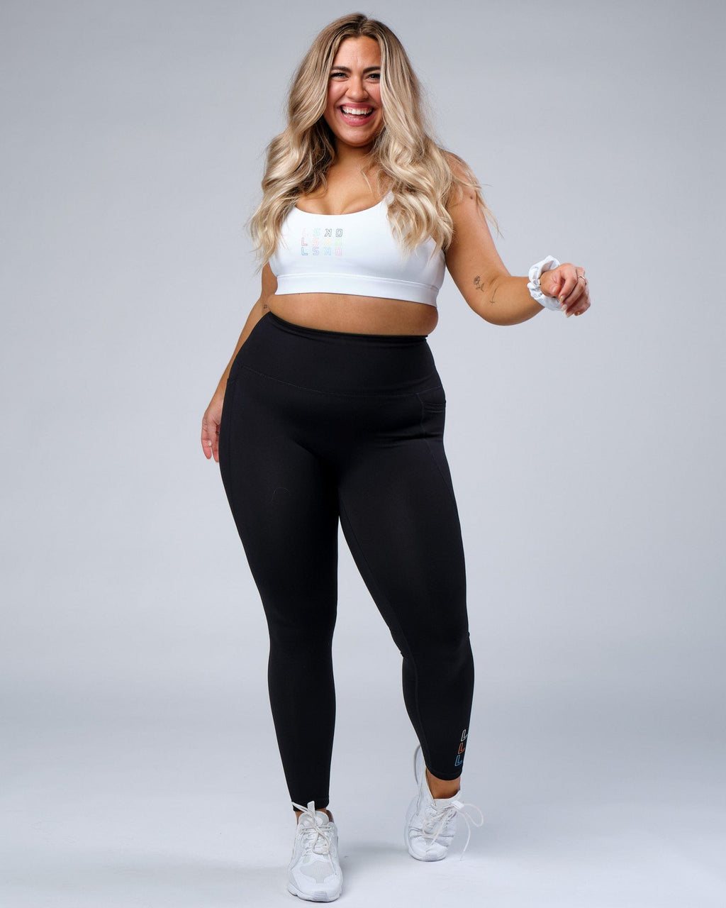 Model wearing Progress Recycled Sports Bra - White