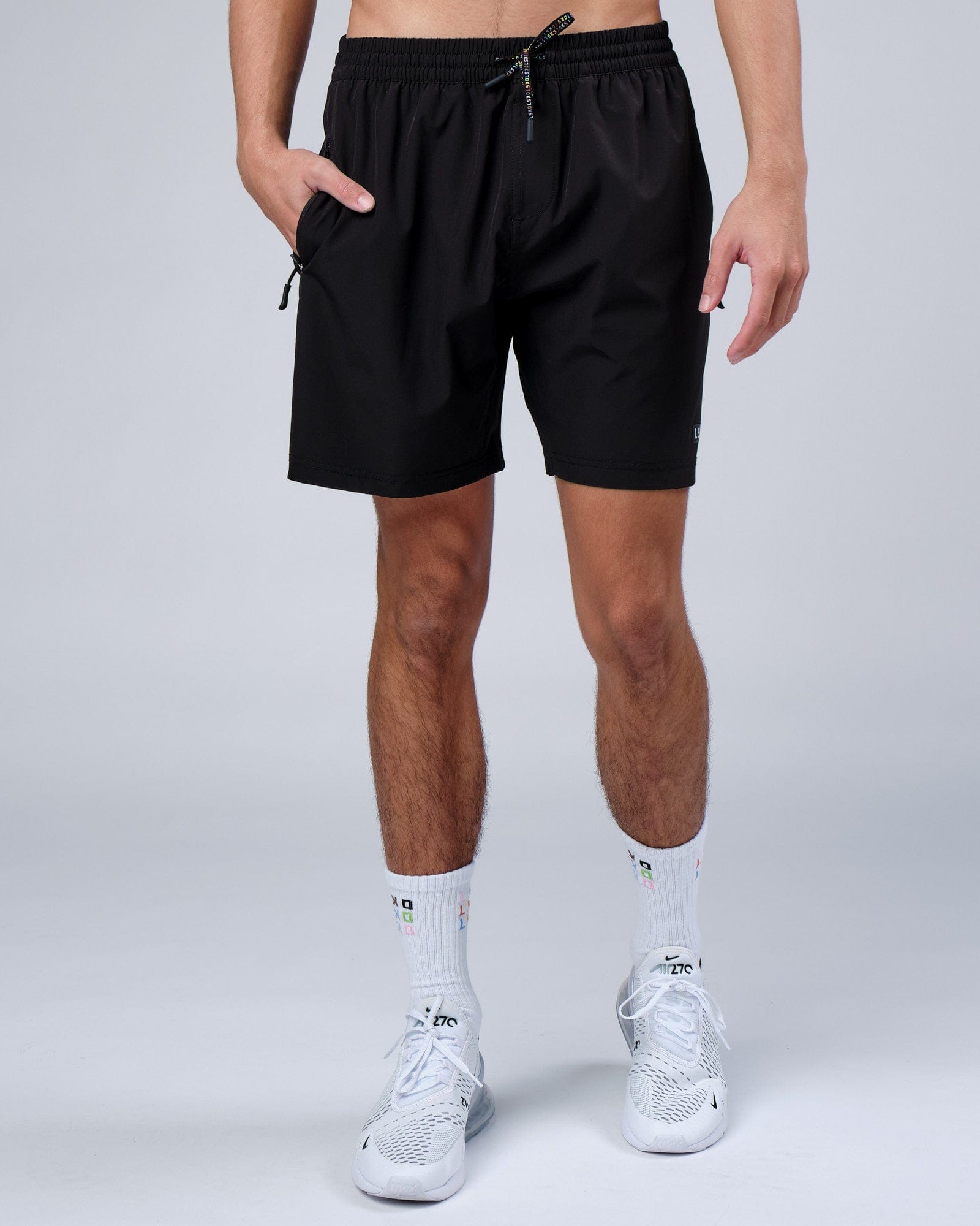 Model wearing Progress Rep 7" Performance Short - Black