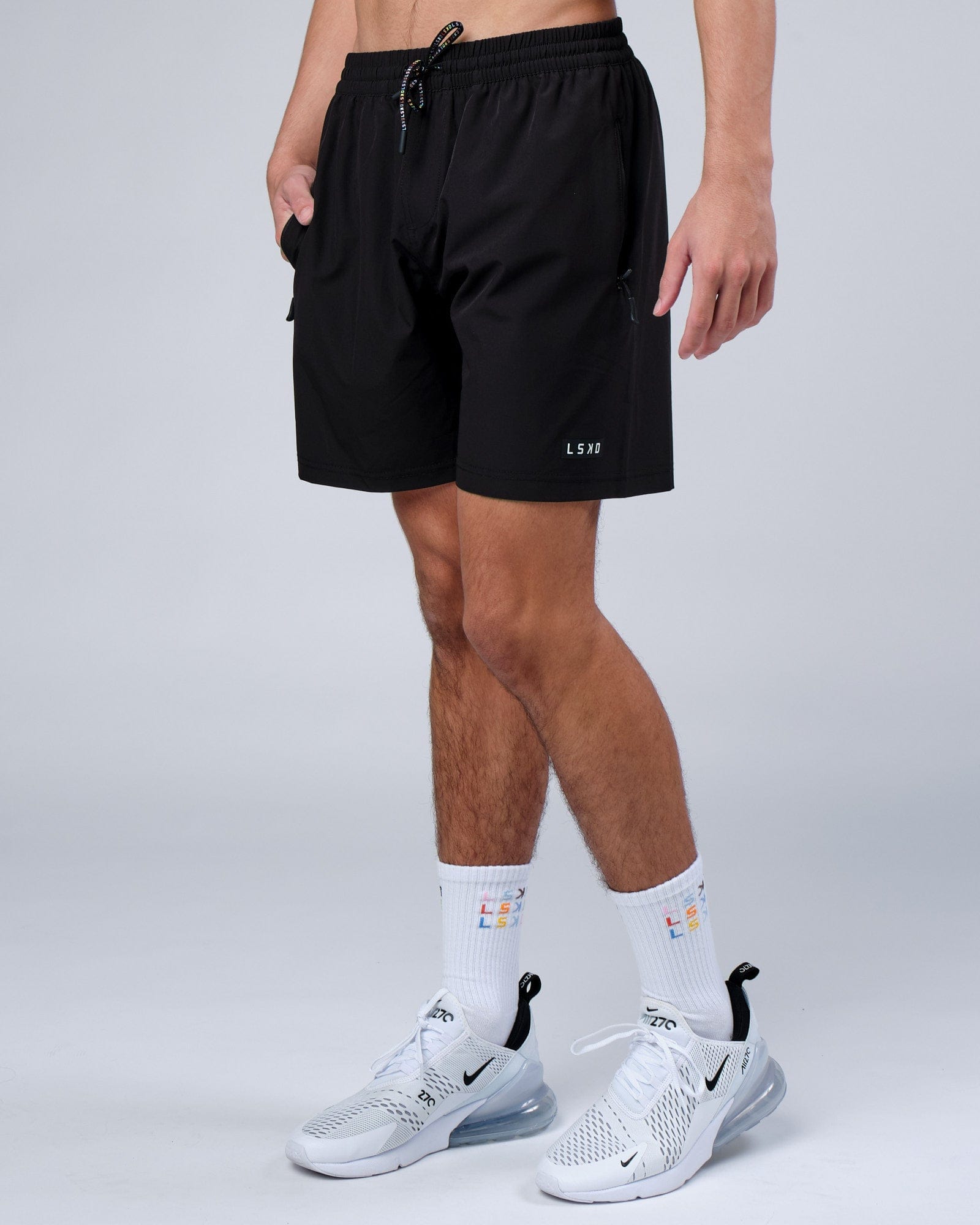 Model wearing Progress Rep 7" Performance Short - Black