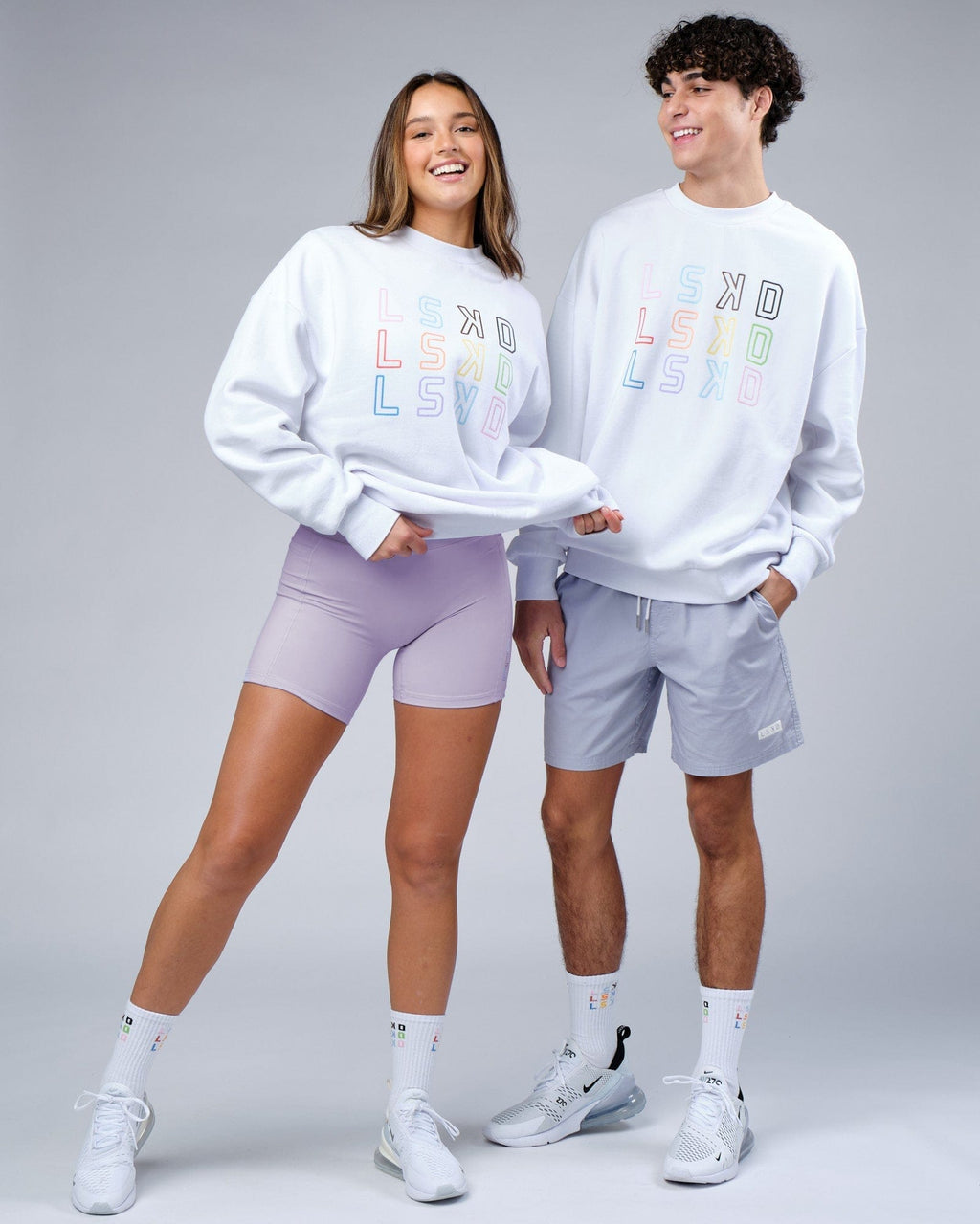 Model wearing Unisex Progress Sweater Oversize - White