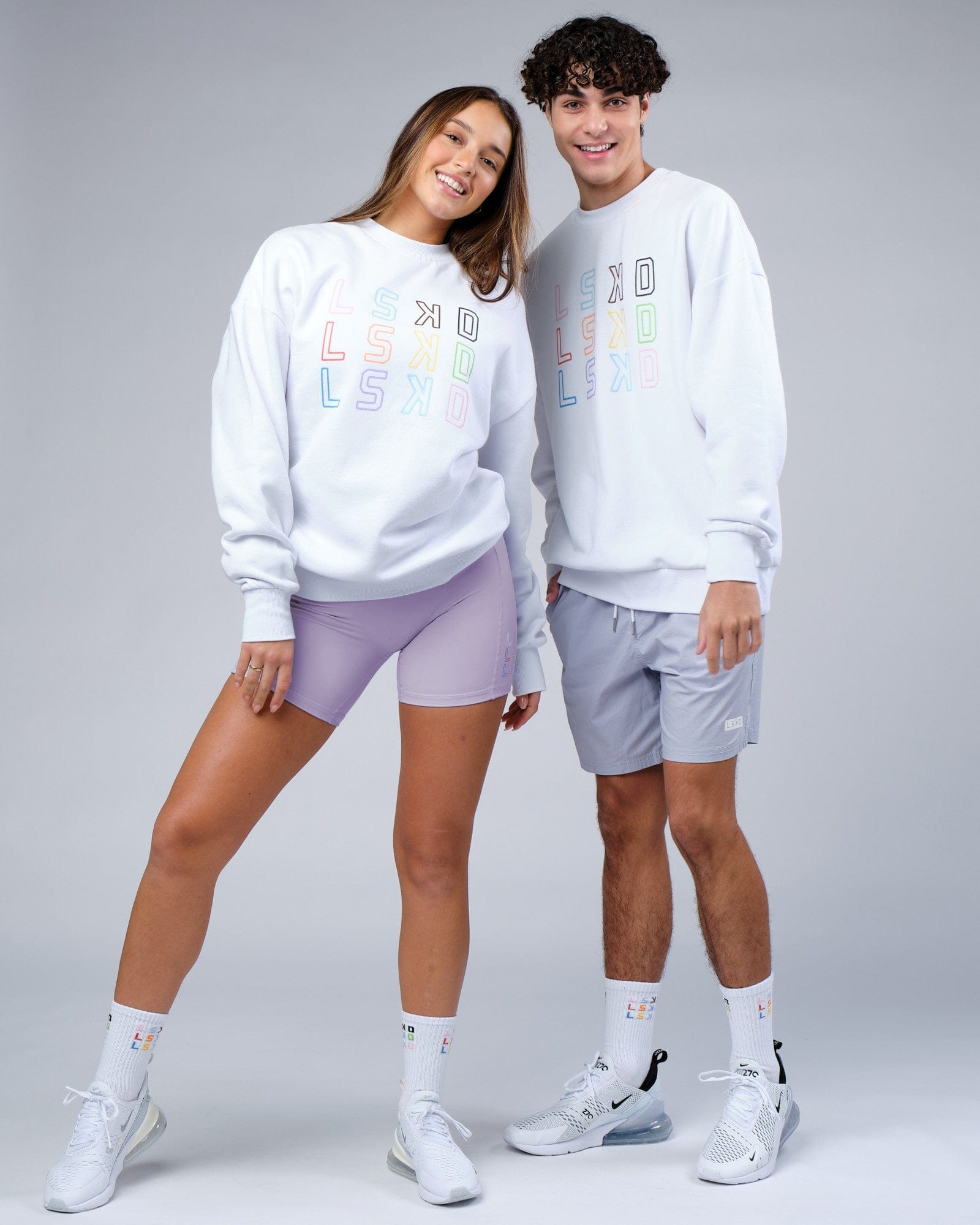 Model wearing Unisex Progress Sweater Oversize - White