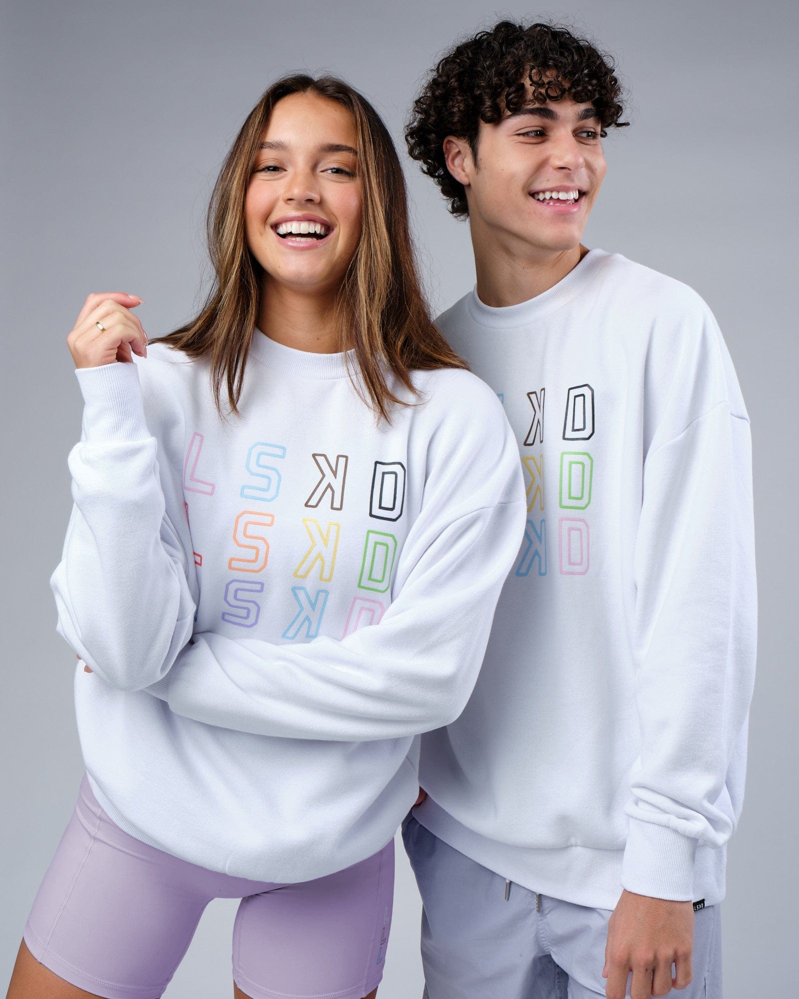 Model wearing Unisex Progress Sweater Oversize - White