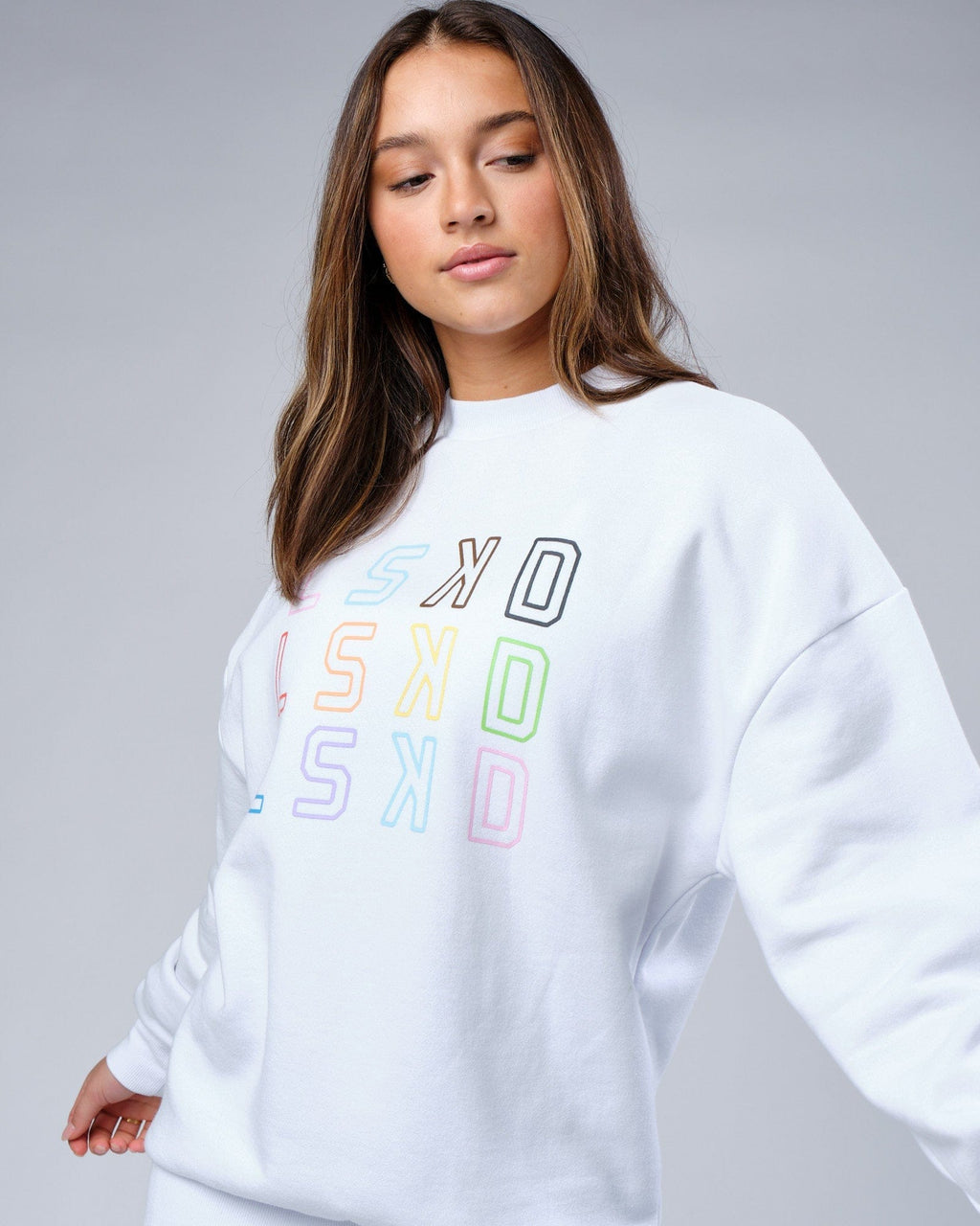 Model wearing Unisex Progress Sweater Oversize - White
