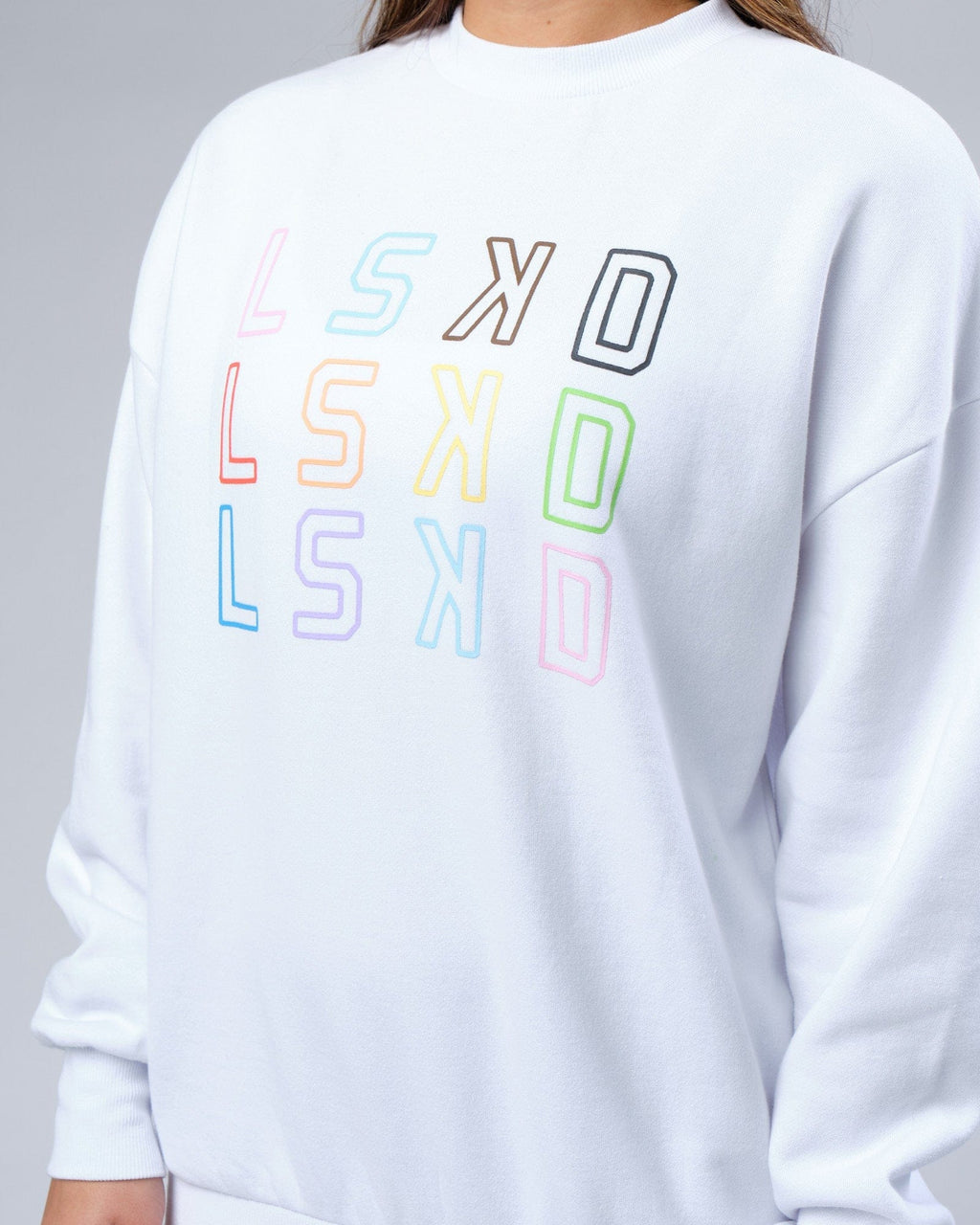 Model wearing Unisex Progress Sweater Oversize - White