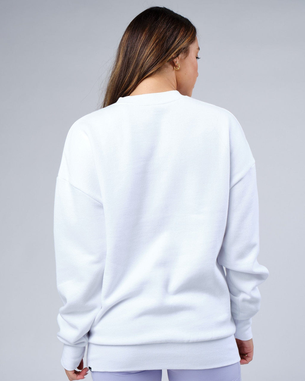 Model wearing Unisex Progress Sweater Oversize - White