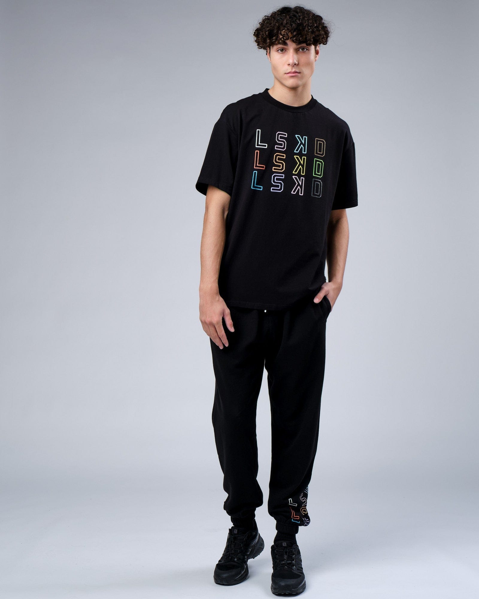 Model wearing Progress Track Pant - Black