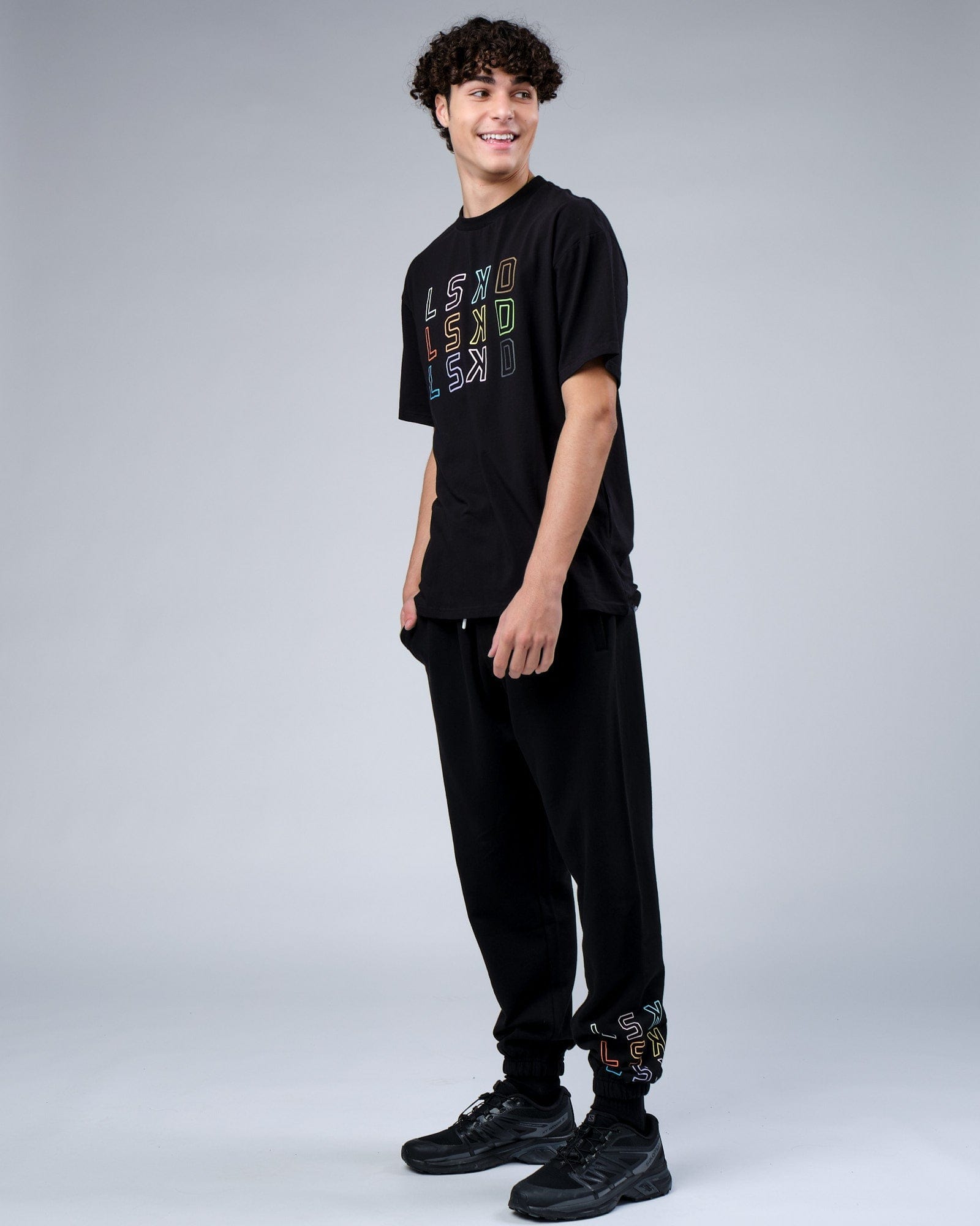 Model wearing Progress Track Pant - Black