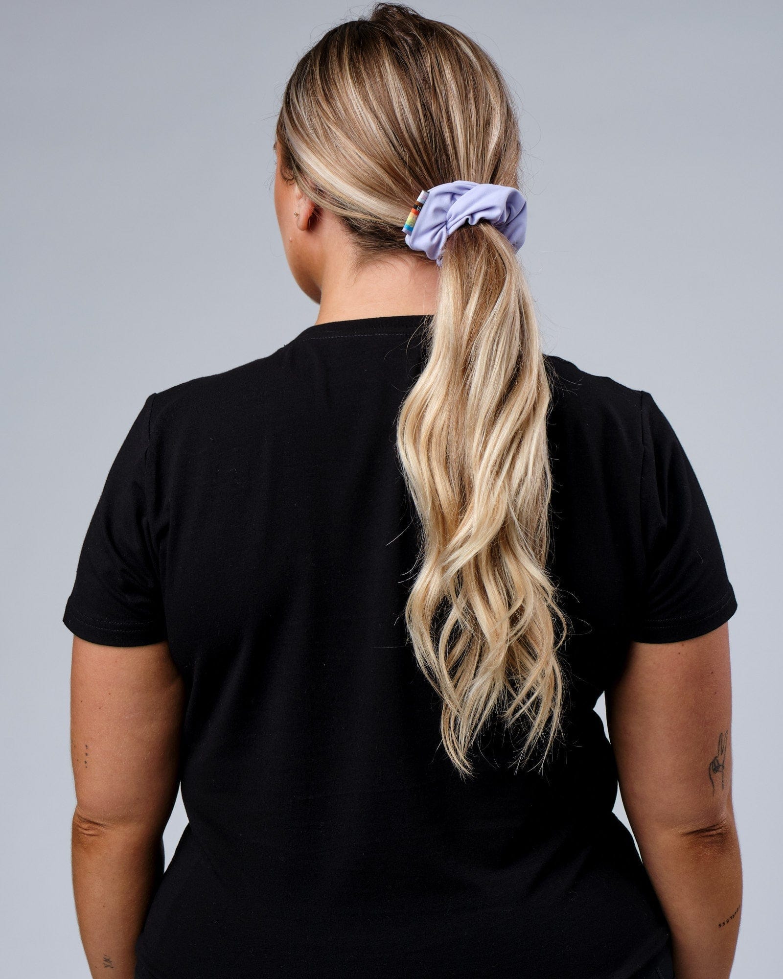 Model wearing Progress Scrunchie - Lavender
