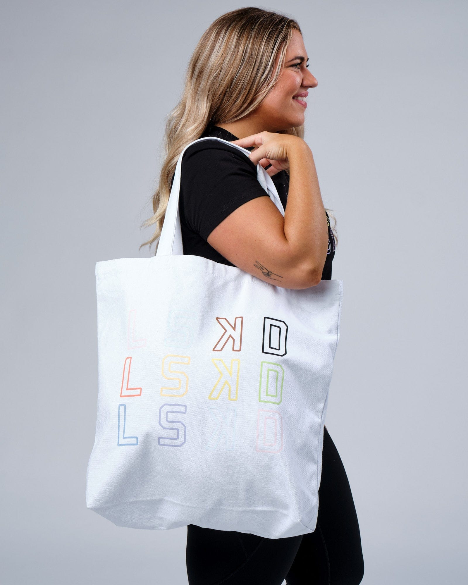 Model wearing Progress Tote - White