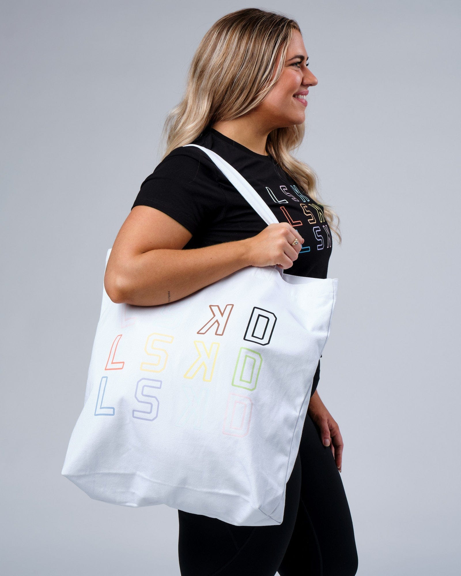 Model wearing Progress Tote - White