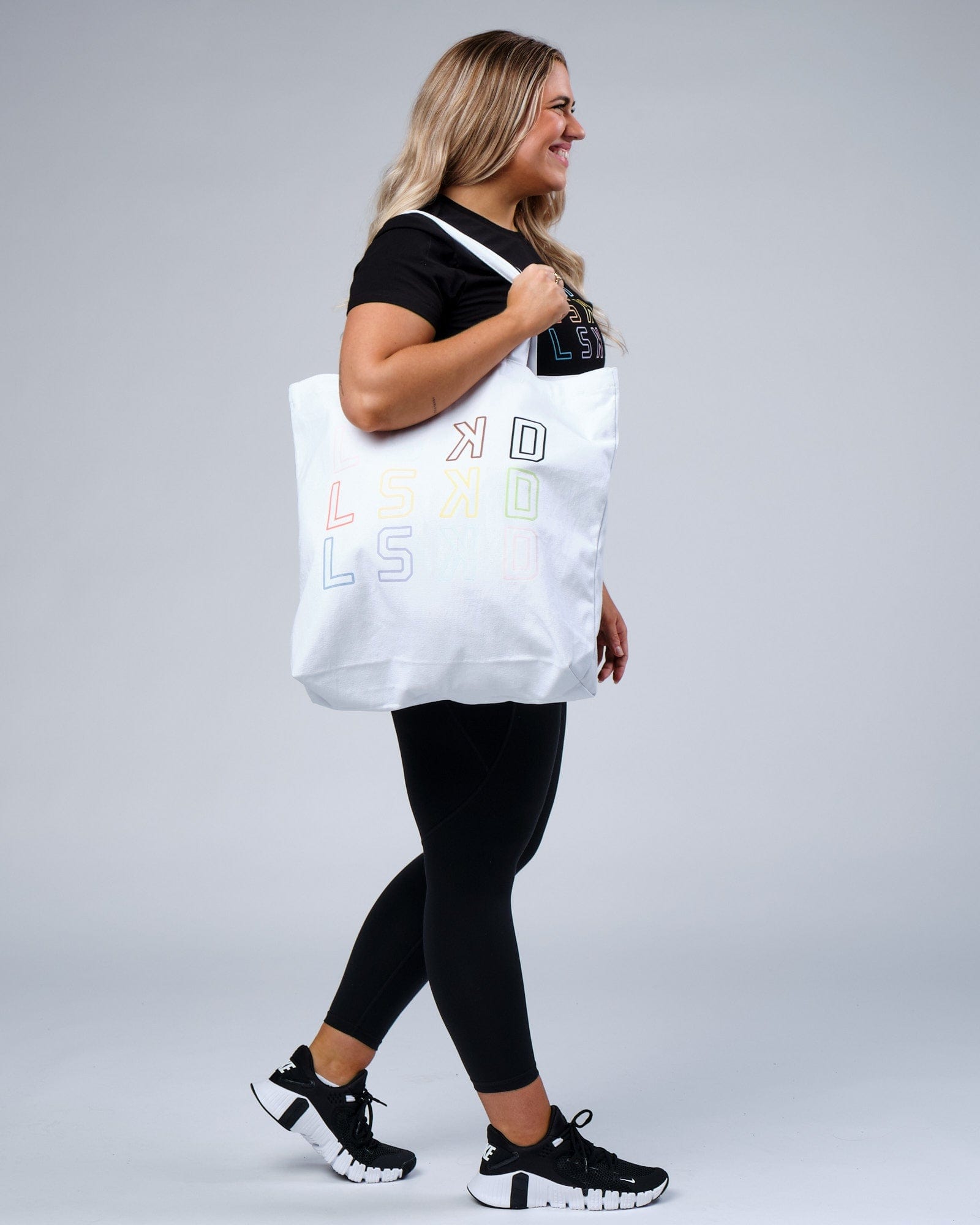 Model wearing Progress Tote - White