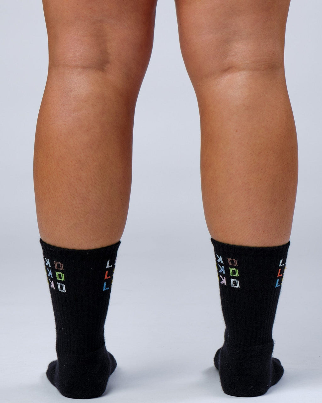 Model wearing Progress Crew Sock - Black