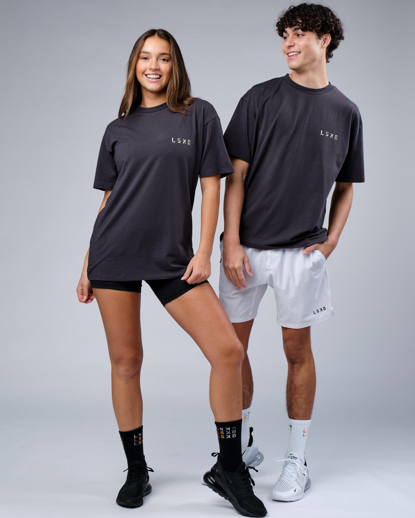 Model wearing Unisex Unity FLXCotton Tee Oversize - Pirate Black