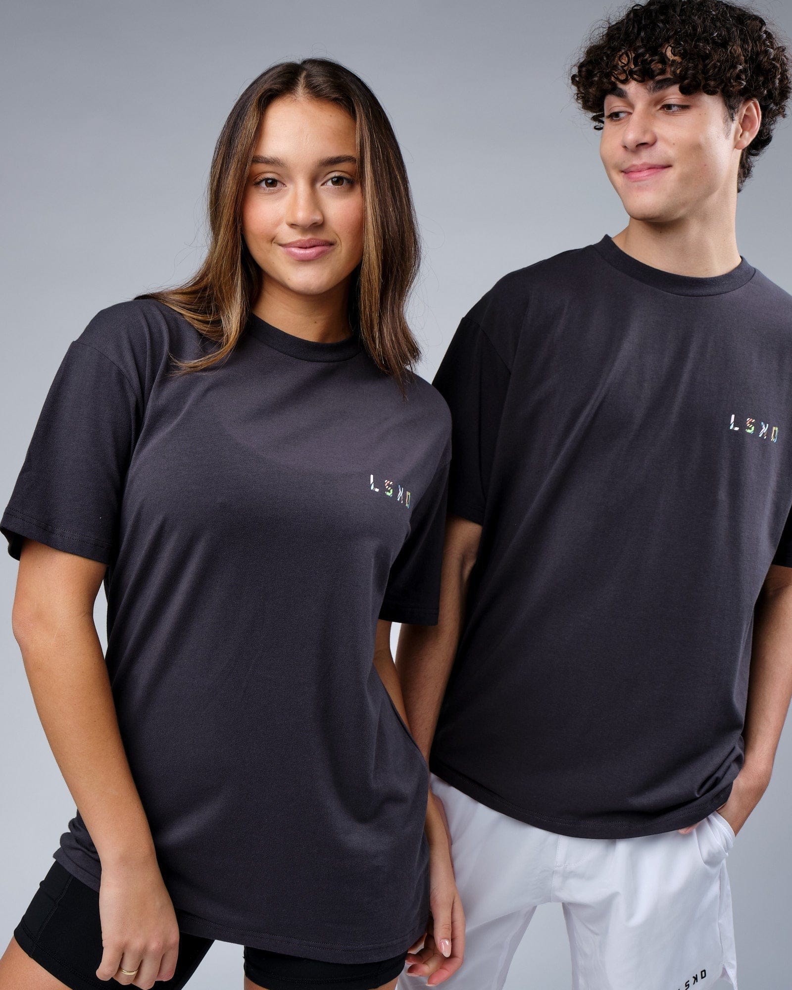 Model wearing Unisex Unity FLXCotton Tee Oversize - Pirate Black