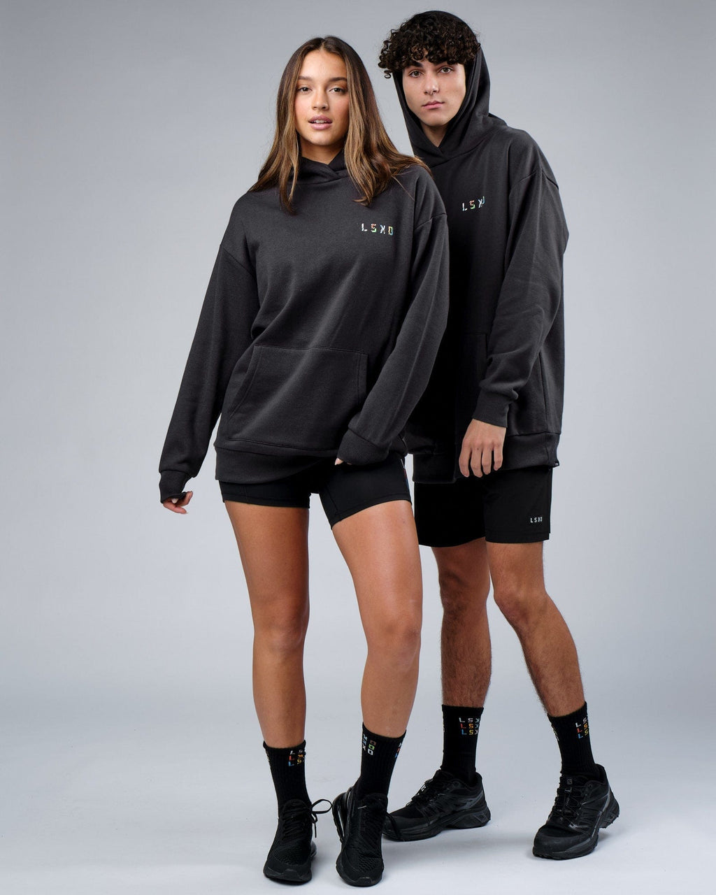 Model wearing Unisex Unity Hoodie Oversize - Pirate Black