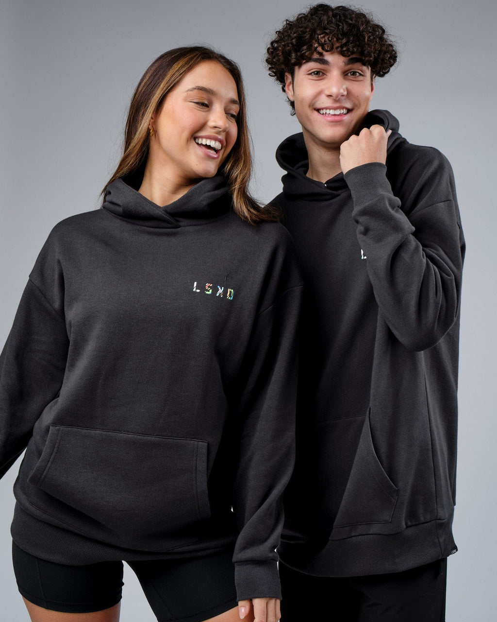 Model wearing Unisex Unity Hoodie Oversize - Pirate Black