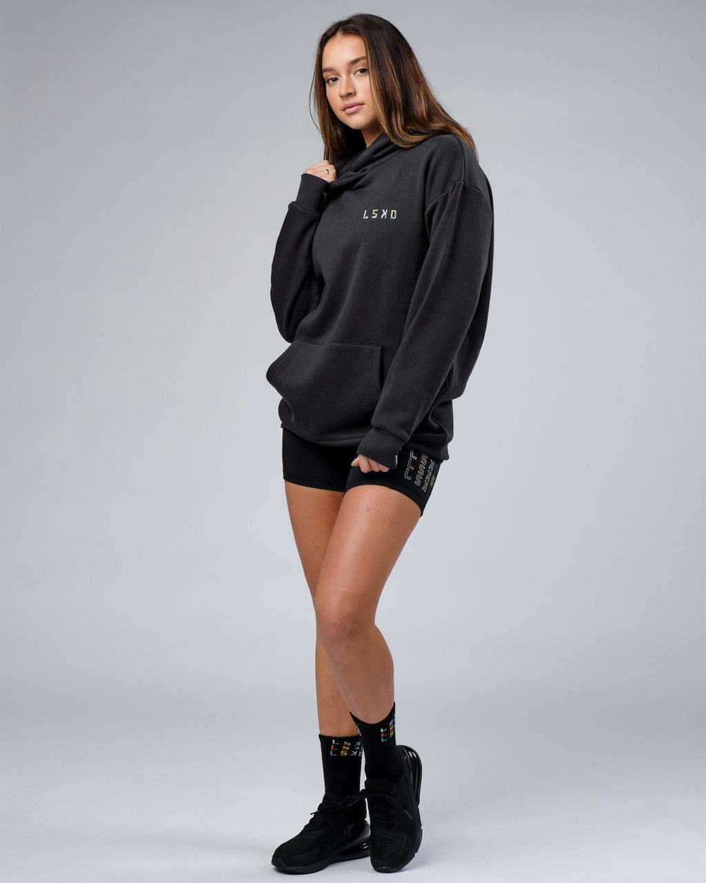 Model wearing Unisex Unity Hoodie Oversize - Pirate Black