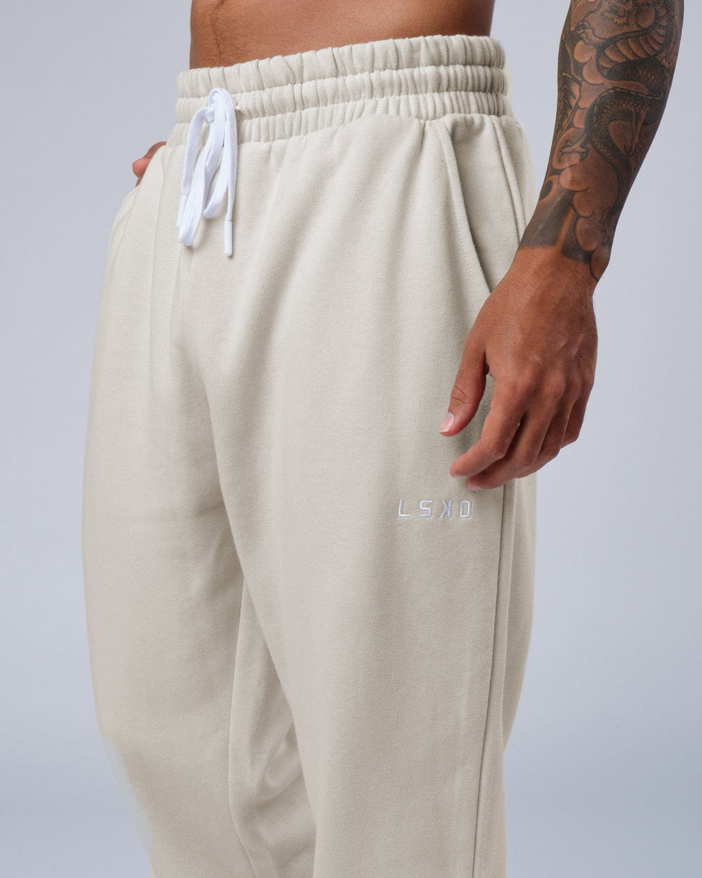 Model wearing Ready Track Pant - Bone