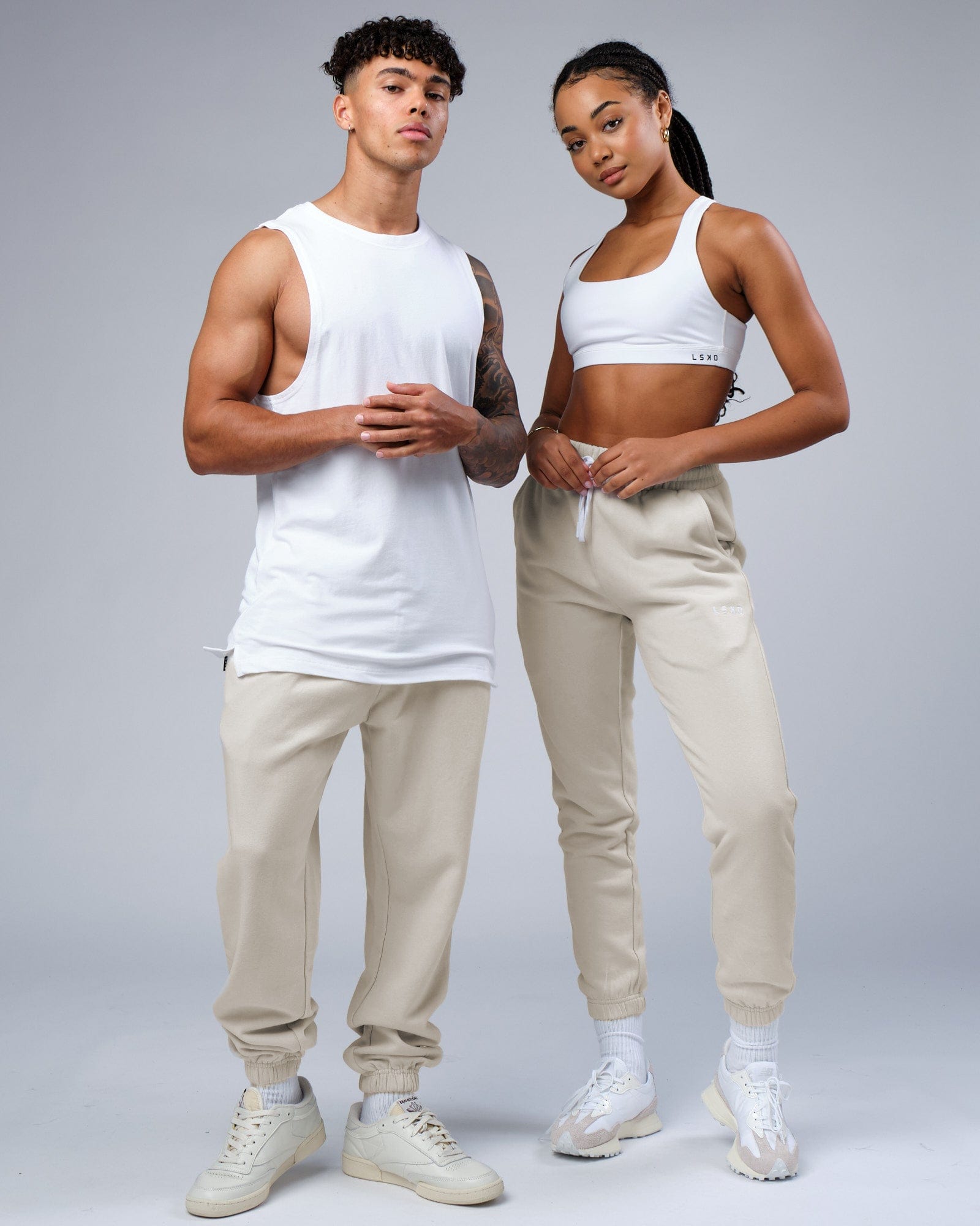 Model wearing Unisex Ready Track Pant - Bone