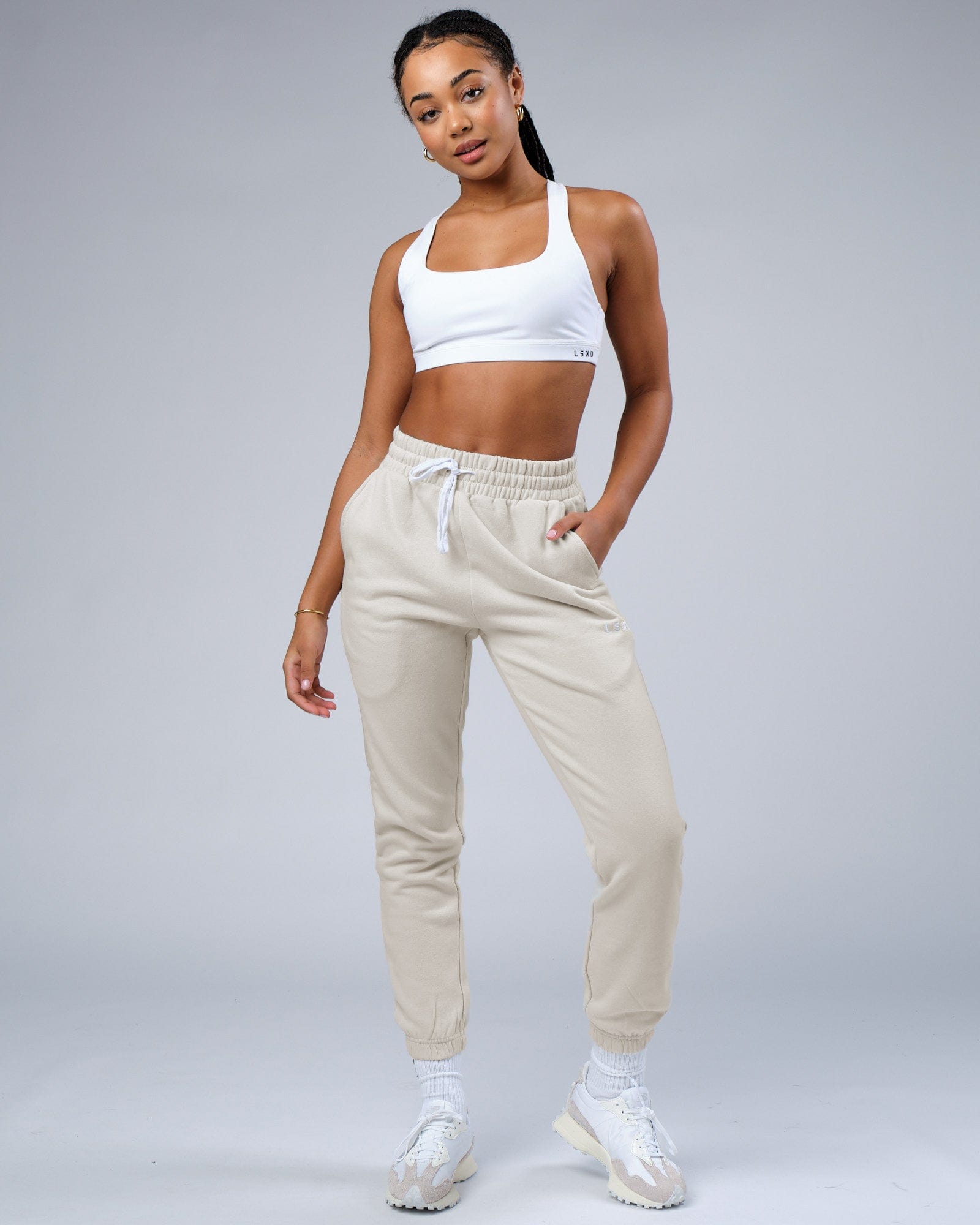 Model wearing Unisex Ready Track Pant - Bone